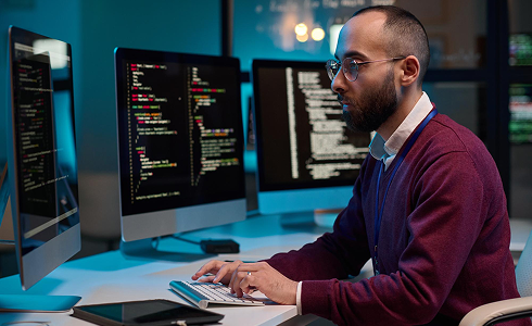 Developer working across multiple screens
