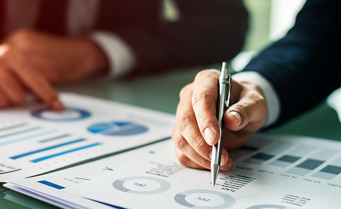 Hands reviewing printed interview notes